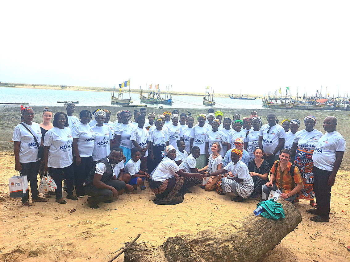USAID WSFS AOR Dan Hicks in a group photo with Narkwa women shellfish harvesters